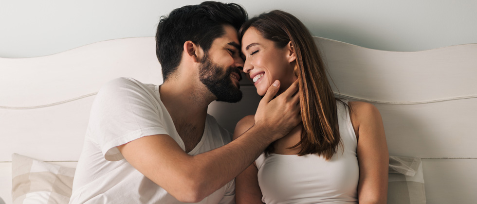 Woman kisses man on the cheek as a symbol of how to kiss well