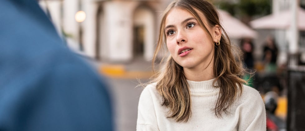 A woman looking at a man, tired of breadcrumbing