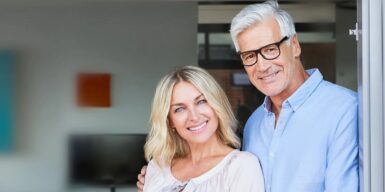 couple over 60 smiling into camera as a symbol of dating over 60