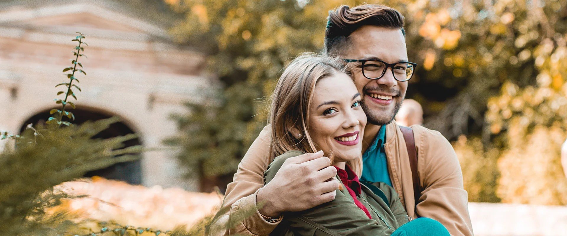 Polish dating symobolized by a couple sitting together and hugging each other